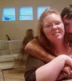 Ghost behind couple